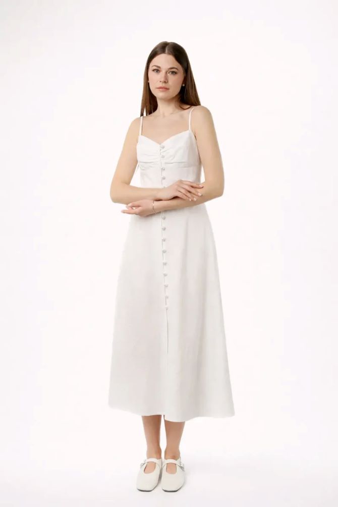 Біла сукня міді April з батисту на бретелях